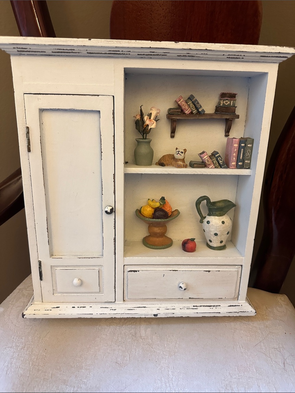 Rustic miniature farmhouse style wooden trinket shelf with drawers for storage